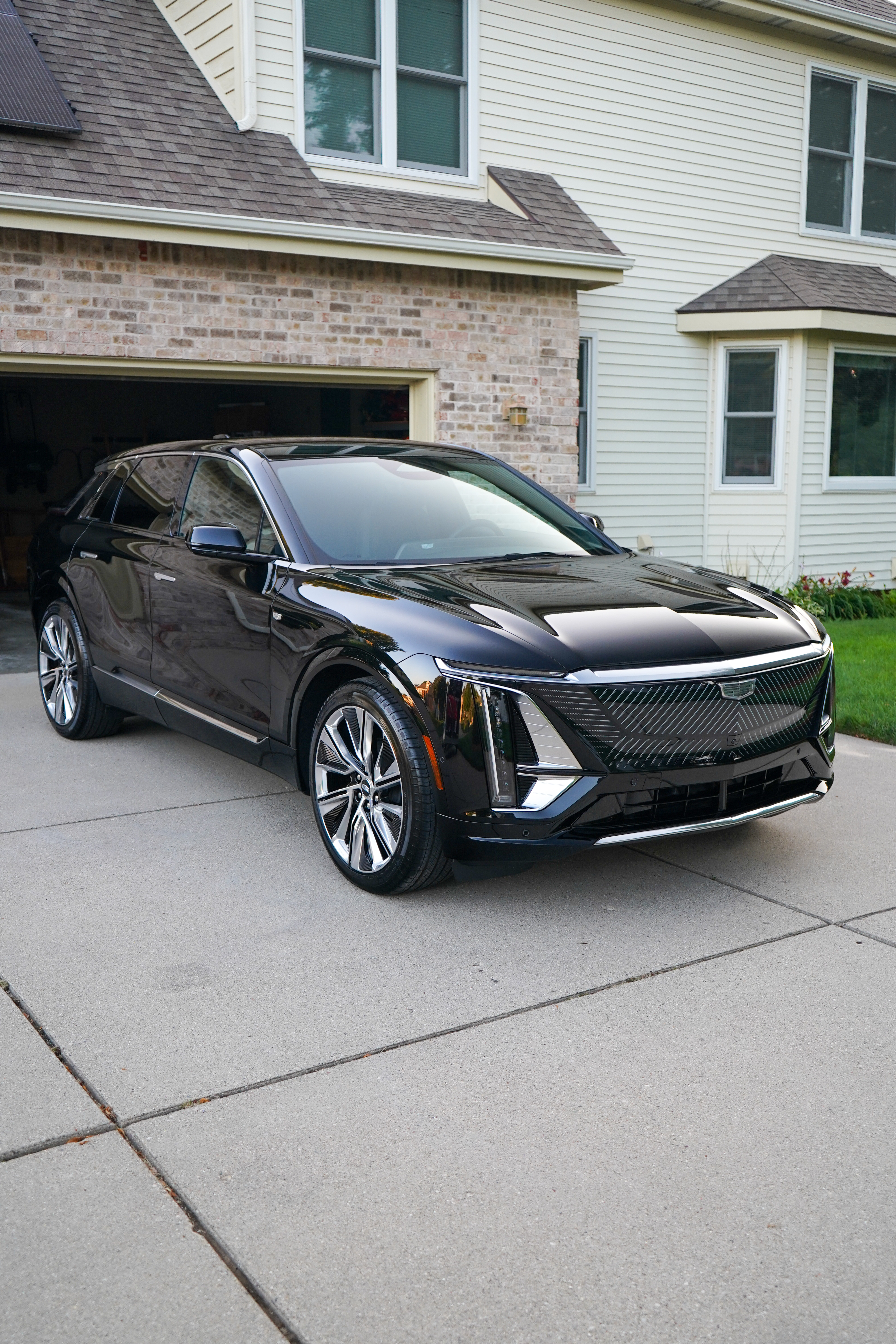 Cadillac Lyriq with System X ceramic coating, side profile in driveway