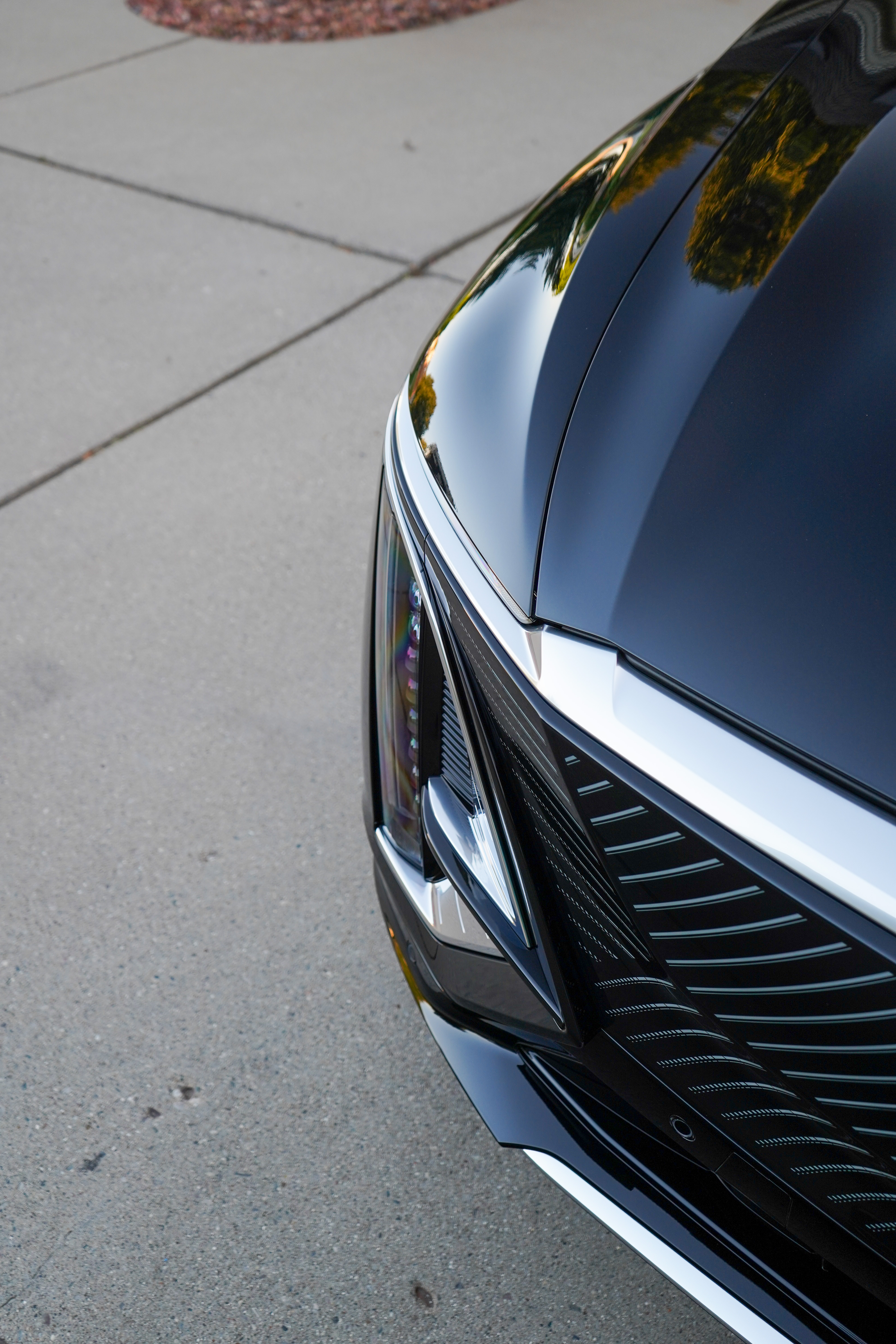 Cadillac Lyriq with System X ceramic coating by After Hours, front detail showing deep gloss