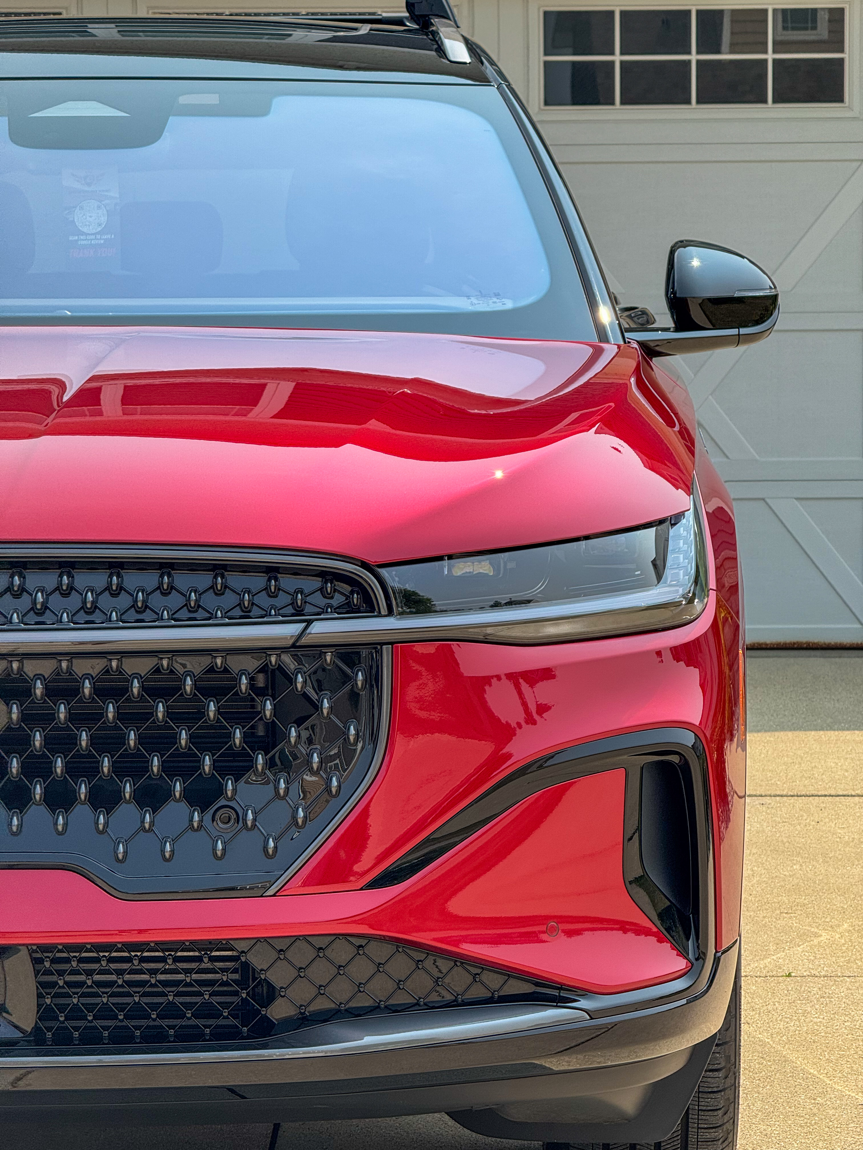 Red Lincoln Nautilus with System X ceramic coating, front view showing deep gloss finish