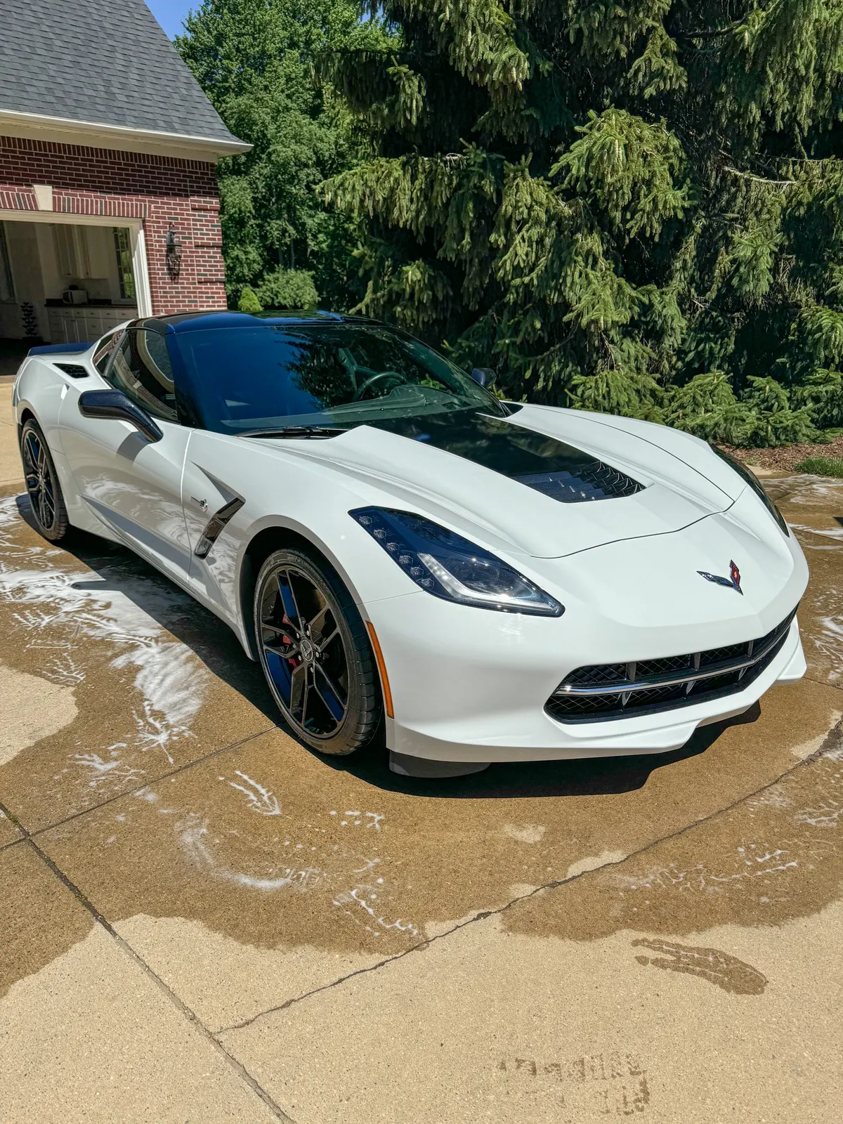White Chevrolet Corvette C7 Stingray after a System X Renew ceramic coating by After Hours Car Detailing in Mid-Michigan
