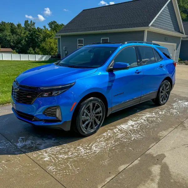 Glossy blue Chevy Equinox exterior detailed by After Hours Car Detailing in Mid-Michigan